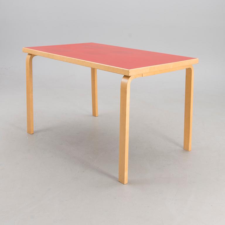 Table with a red linoleum top, Artek, 1960s-1970s.