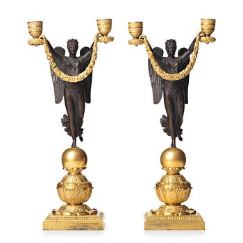 92. A pair of Empire two-light candlesticks, beginning of the 1800's.