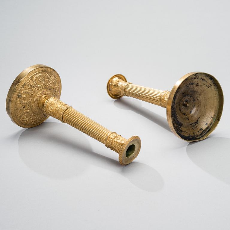 A PAIR OF CANDLESTICKS, gilt bronze, empire early 19th century.