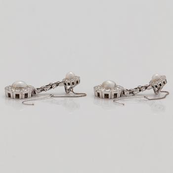 A pair of probably natural saltwater pearl, cultured pearl and brilliant cut diamond earrings.