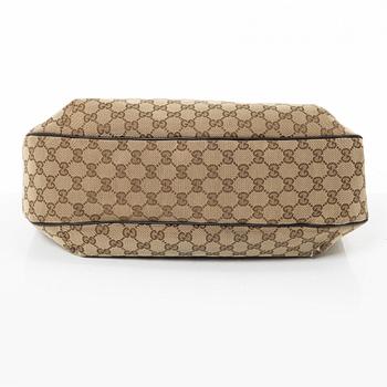 Gucci, GG Supreme bag.