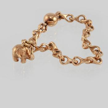 ARMBAND, 18K guld, en berlock med briljantslipad diamant, Ole Lynggaard.