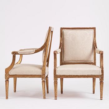 A near pair of Gustavian giltwood fauteuils, Stockholm, late 18th century.