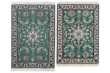 A pair of Nain rugs, part silk, c. 84 x 57 cm & c. 90 x 59 cm.