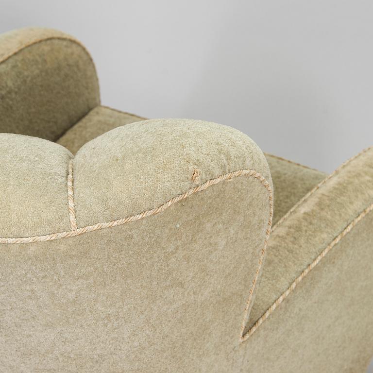 A pair of mid-20th century armchairs.