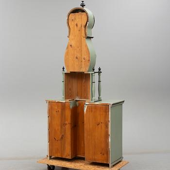 A combined clock and chest of drawers from late 19th  century.