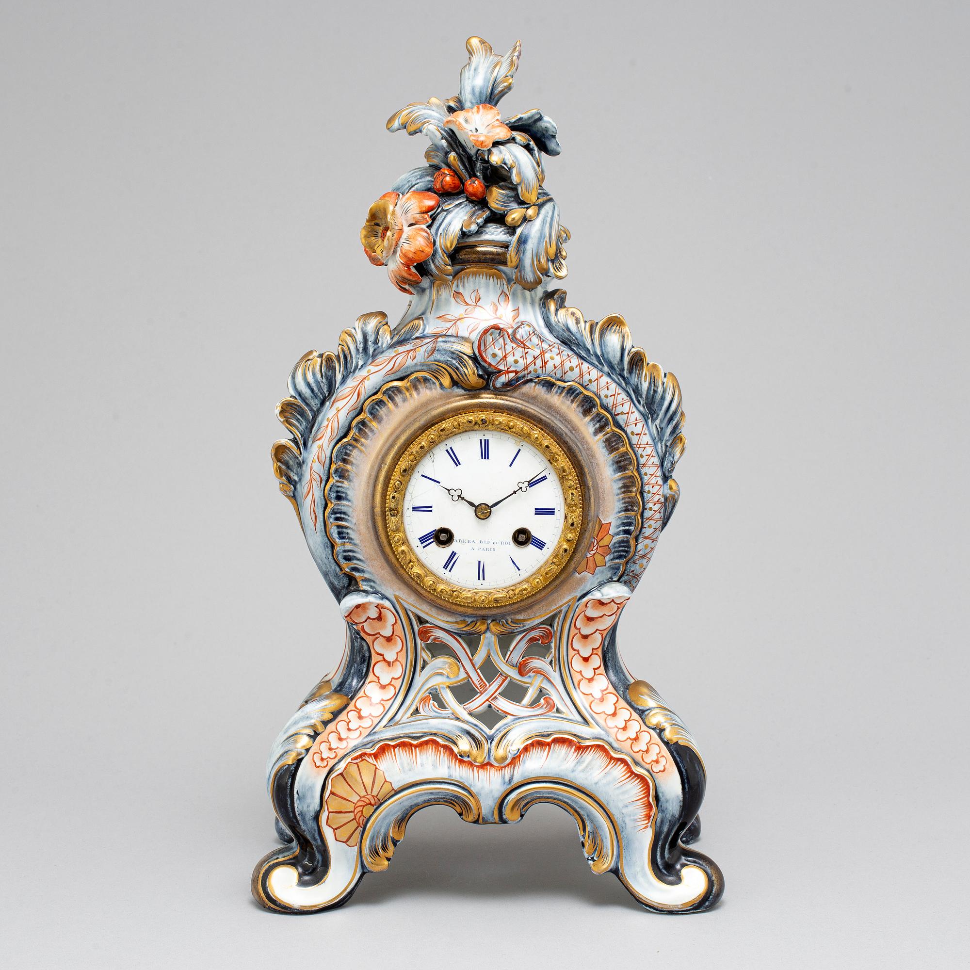 A new rococo creamware bracket clock, after Meissen model, early 20th century.