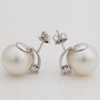 A pair of cultured South sea pearl and brilliant cut diamond earrings.