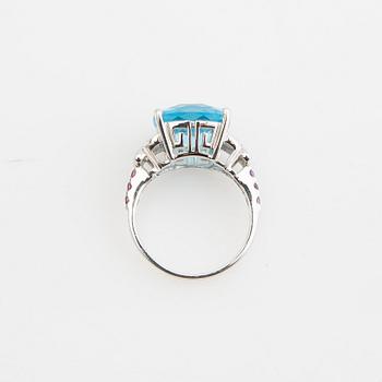 Ring, 14K gold with topaz, diamonds, and purple garnets.