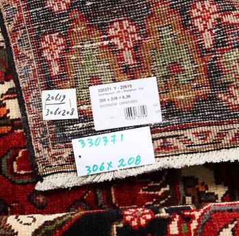 An Azerbaijan carpet, c. 306 x 208 cm.