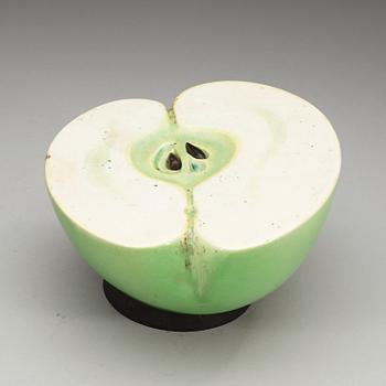 A Hans Hedberg faience half of an apple, Biot, France.