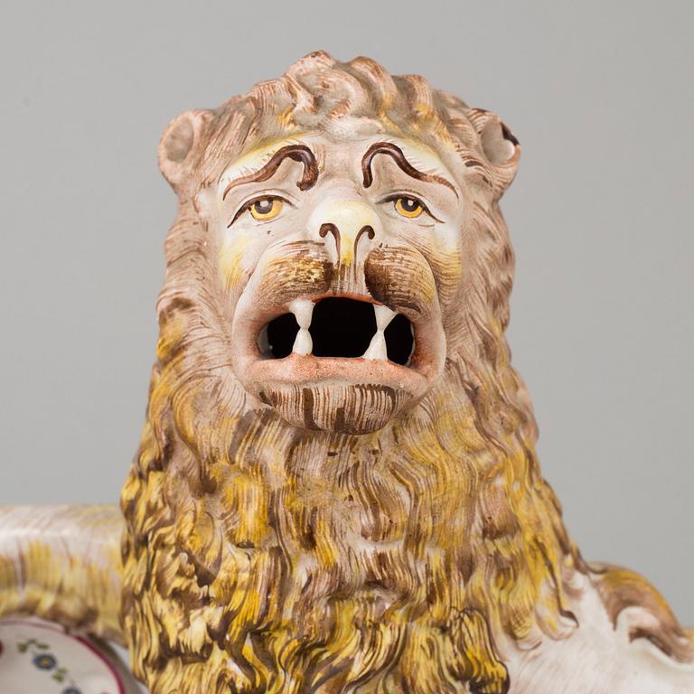 A PAIR OF FRENCH FAYENCE BOOK ENDS, 20th century.