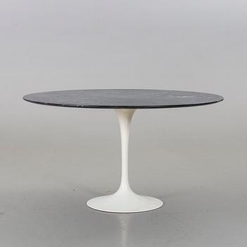 AN EERO SAARINEN "TULIP" TABLE BY KNOLL INTERNATIONAL.