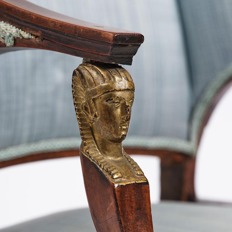 A pair of late Gustavian mahogny armchairs.