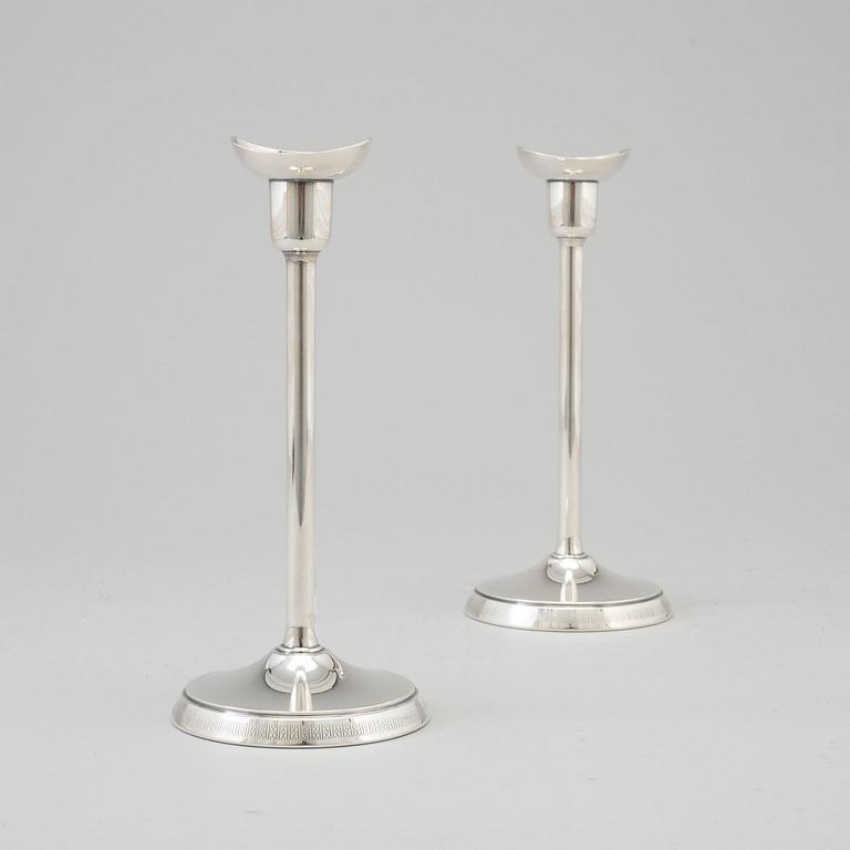 A pair of silver candlesticks by GAB, Stockholm, 1970.
