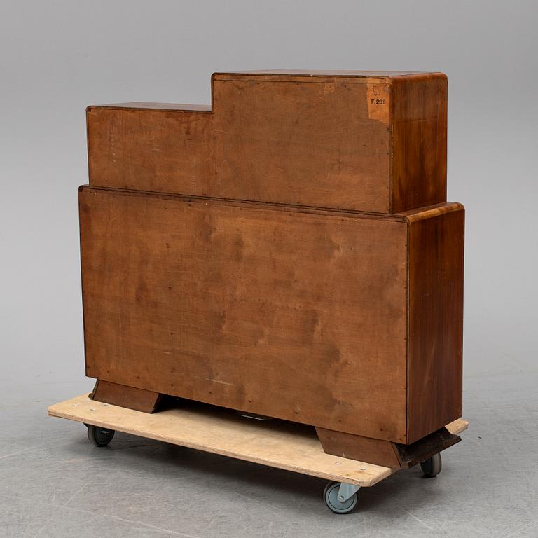 A walnut veneered cabinet, 1930's.