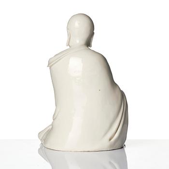 A blanc de Chine seated figure of Bodhidharma, Qing dynasty.