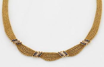 An 18K gold necklace set with eight-cut diamonds and sapphires.