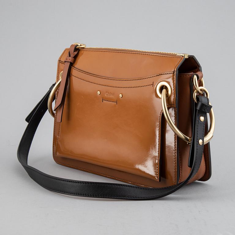 CHLOÉ, a small caramel 'Roy bag'.