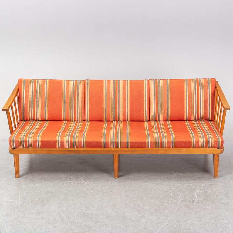 A Swedish 1960s Carl Malmsten pine wood sofa.