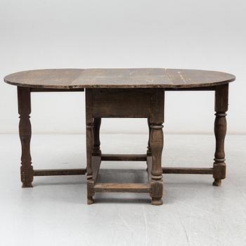 A Baroque-style gate leg table, 19th century.