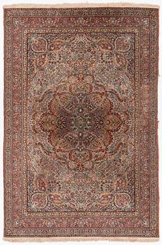 A semi-antique oriental carpet, c. 290 x 195 cm.