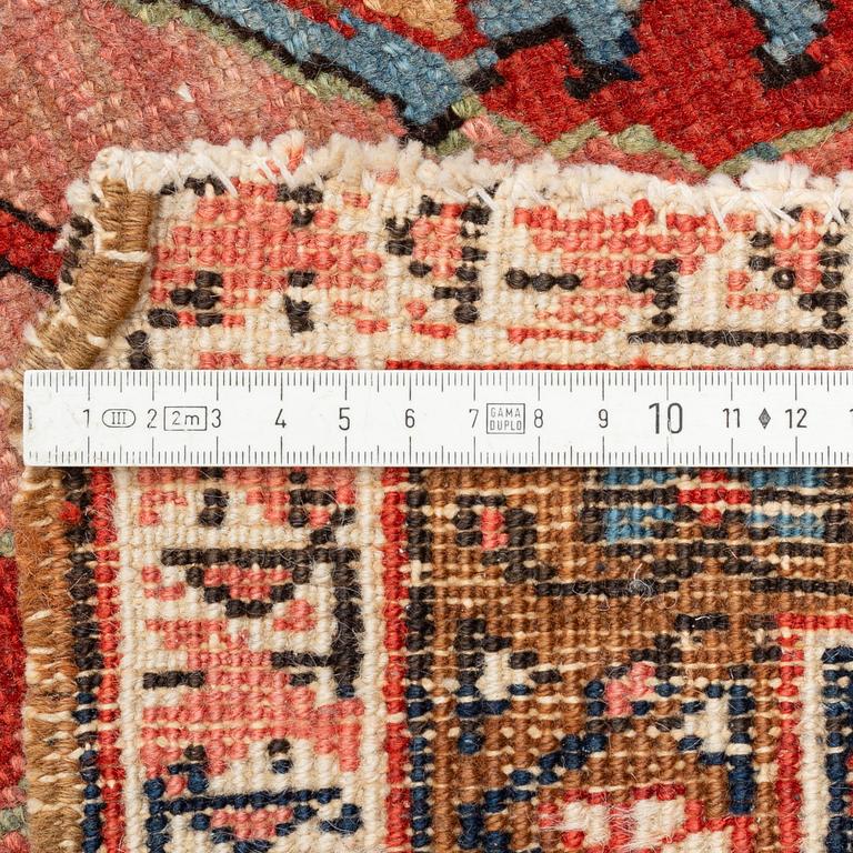 A antique Heriz carpet, ca 384 x 275 - 290 cm.