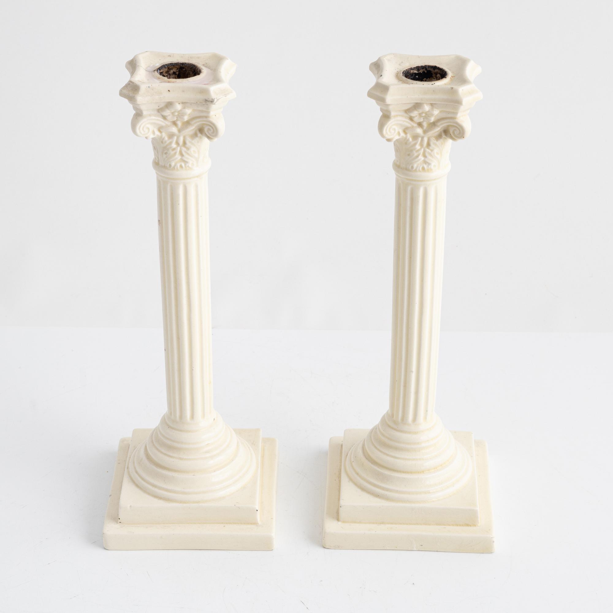 A pair of creamware candlesticks, around 1900.