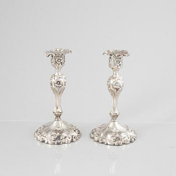 A Pair of Swedish Rococo Revival Silver Candlesticks, mark of Gustaf Möllenborg, Stockholm 1865.