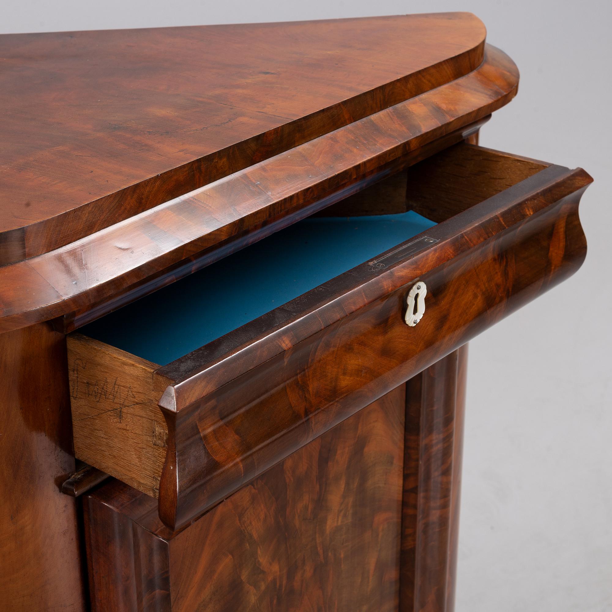 A pair of mahogany corner cabinets, mid 19th Century.