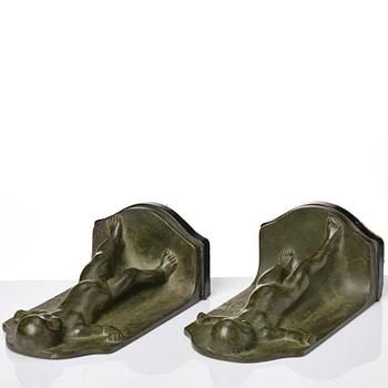 Axel Gute, a pair of green patinated metal bookends, Sweden, dated 1920.