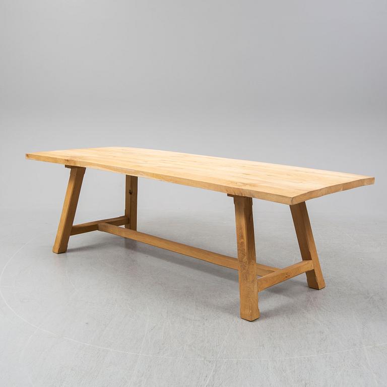 A contemporary oak table and two benches from Garbo Interiors.