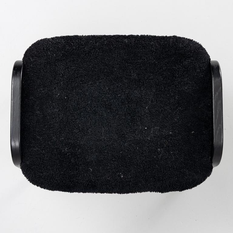 Yngve Ekström, a 'Lamino' easy chair with foot stool, Swedese 2010.