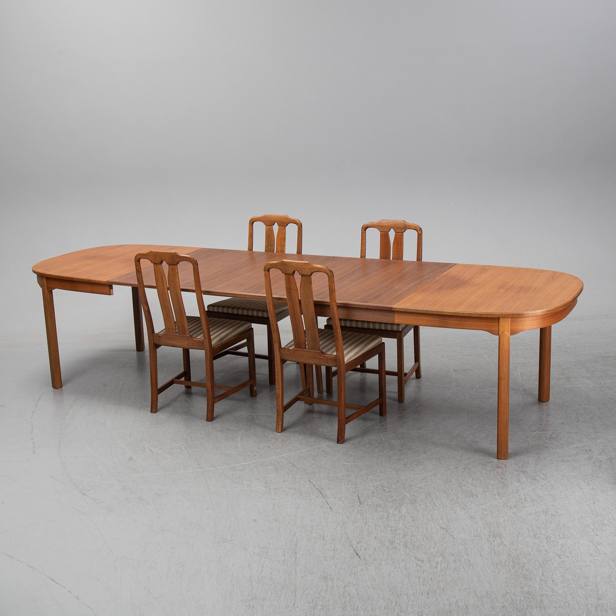 Carl Malmsten, A five-piece walnut 'Ambassadör' dining suite by Carl Malmsten.
