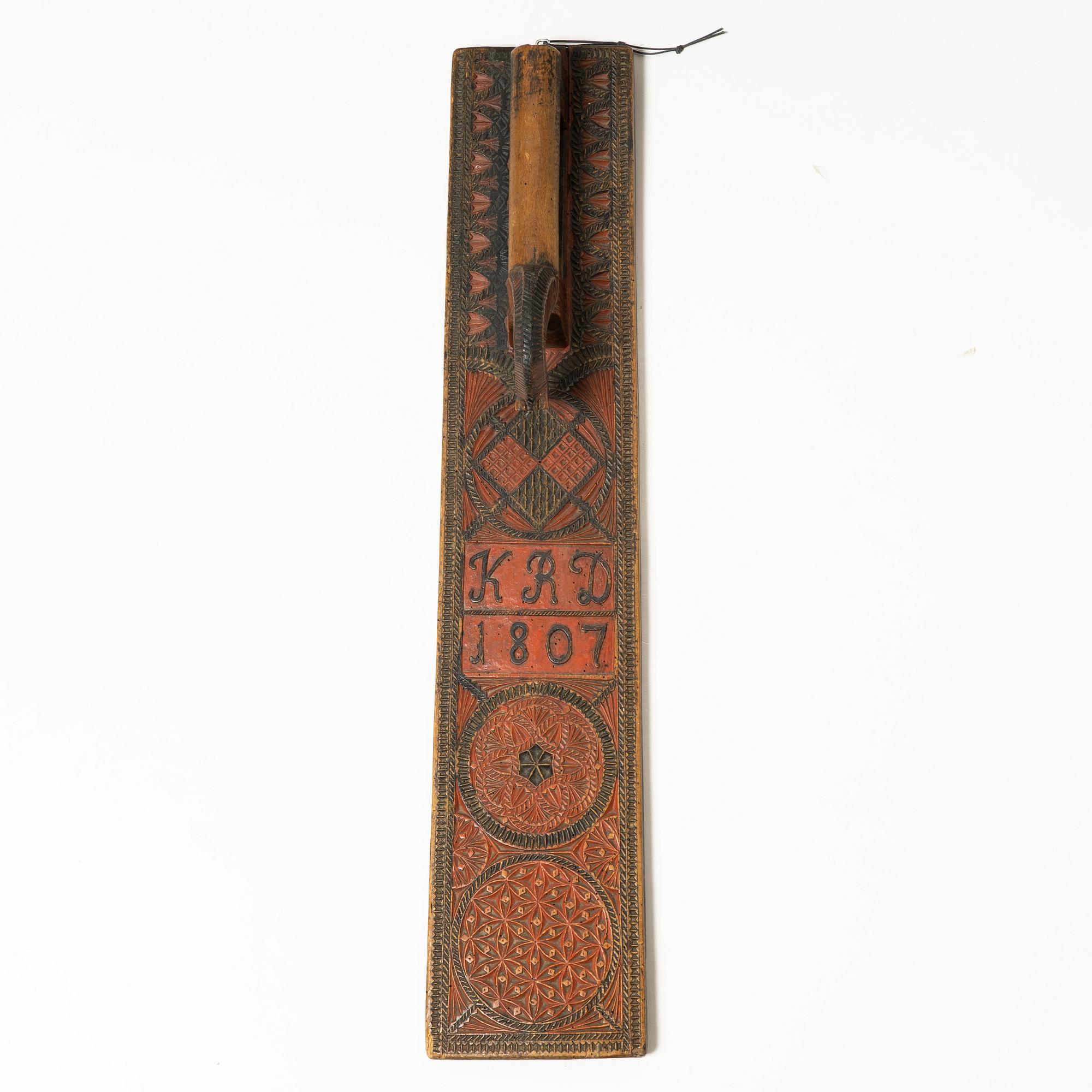 A painted wooden mangle board, Southern Sweden, dated 1807.