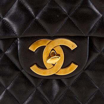 A Chanel maxi jumbo leather bag.