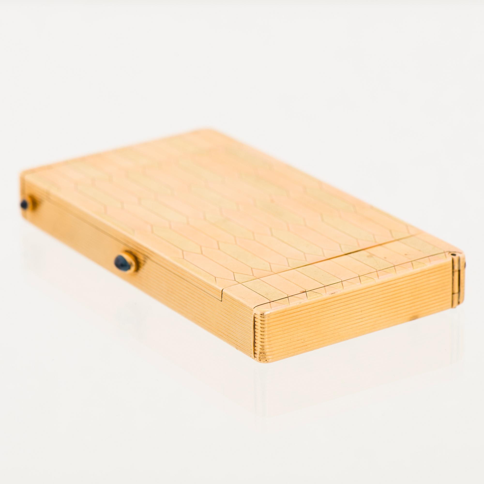 A CARTIER CASE, 18K gold in three colours, cabochon cut sapphires.
