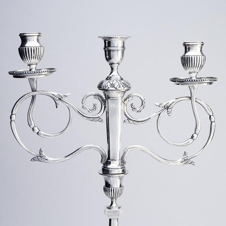 A pair of Swedish silver candelabras, marks of Pehr Zethelius, Stockholm 1797 and Daniel Hedberg, Eksjö 1829.