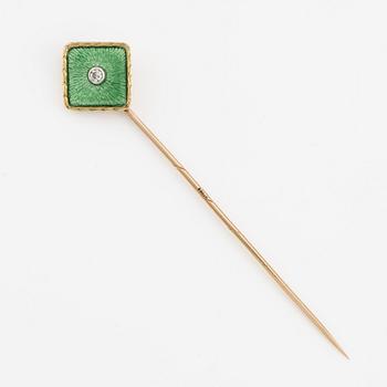 A tie pin 14K gold and guilloché enamel with a diamond.