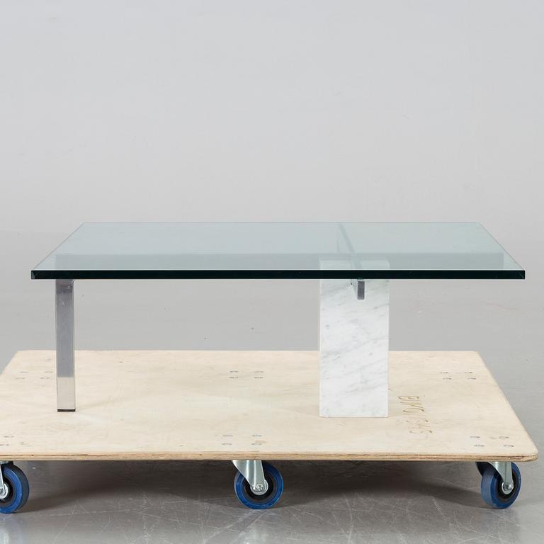 A GLASS TOP COFFEE TABLE, CA 2000.