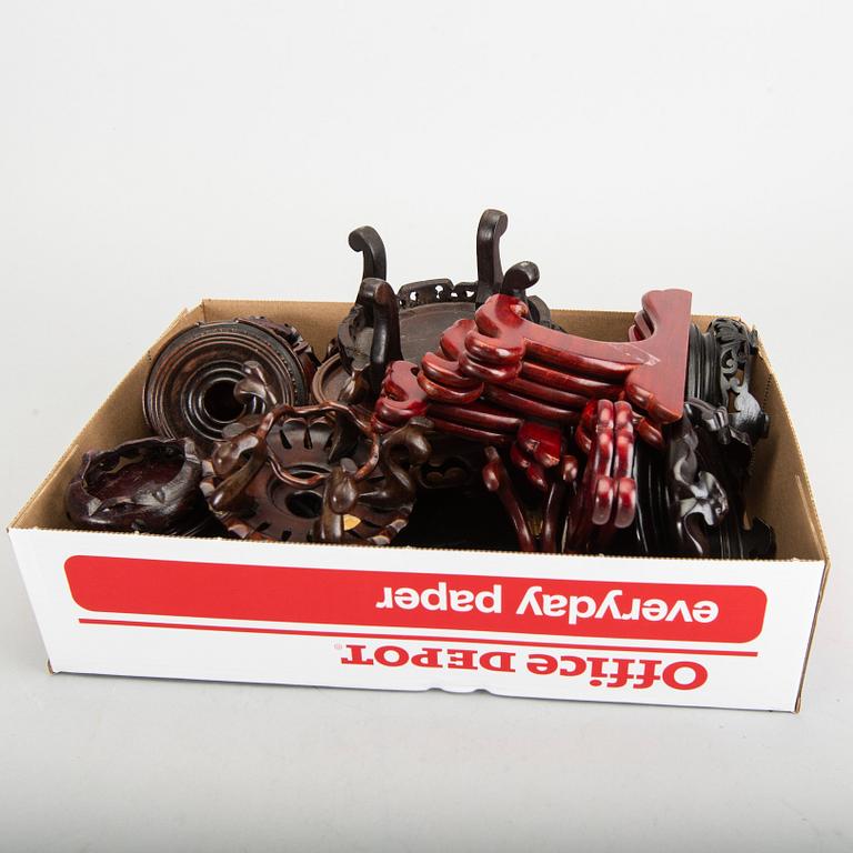 A set of 23 wooden stands, 20th century.