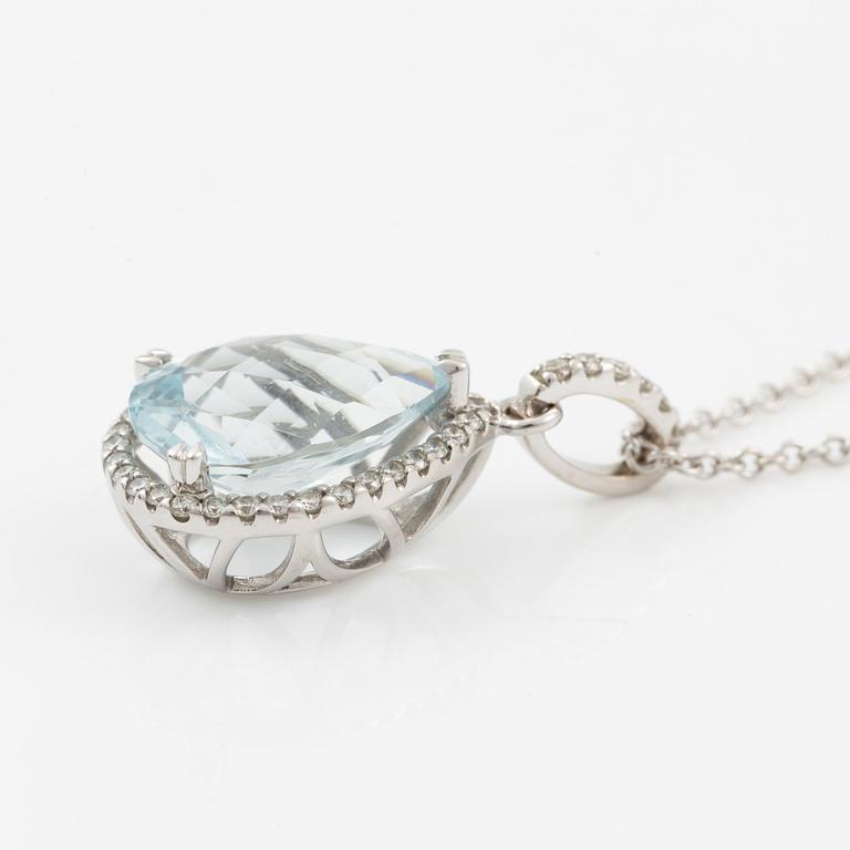 Pendant with chain in 18K white gold set with a faceted aquamarine and round brilliant-cut diamonds.