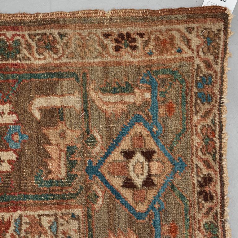 A carpet, an antique Heriz, ca 454,5-460,5 x 268-285 cm.