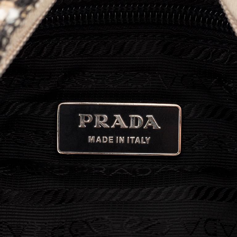 Prada, a tweed and leather bag.