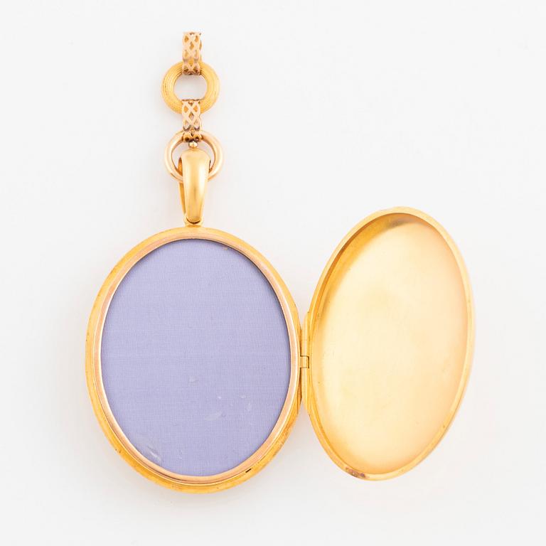 A gold locket with chain.