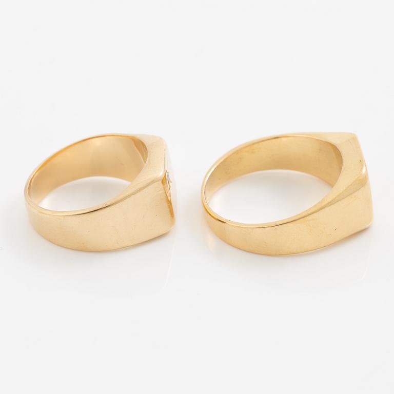 Two rings 18K gold.