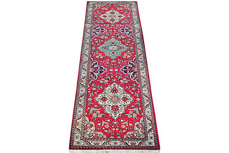A runner carpet, Tabriz, c. 402 x 88 cm.