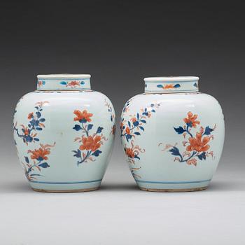 A pair of imari jars with covers, Qing dynasty, 18th Century.
