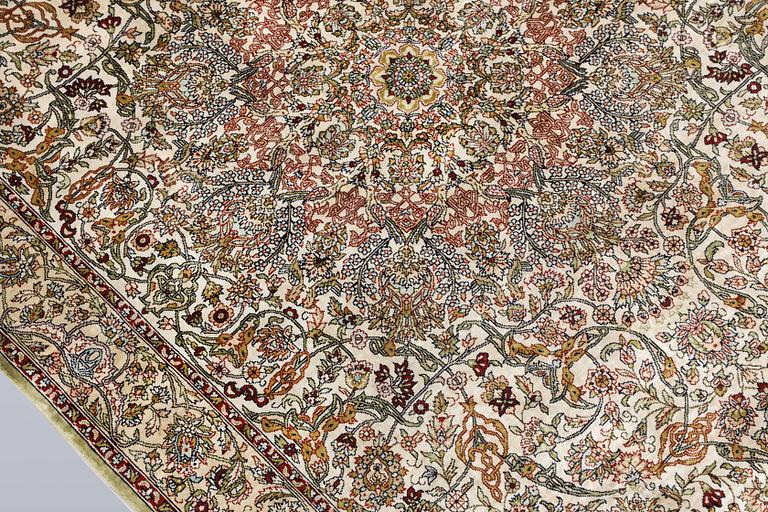 An Oriental silk rug, approx. 153 x 95 cm.