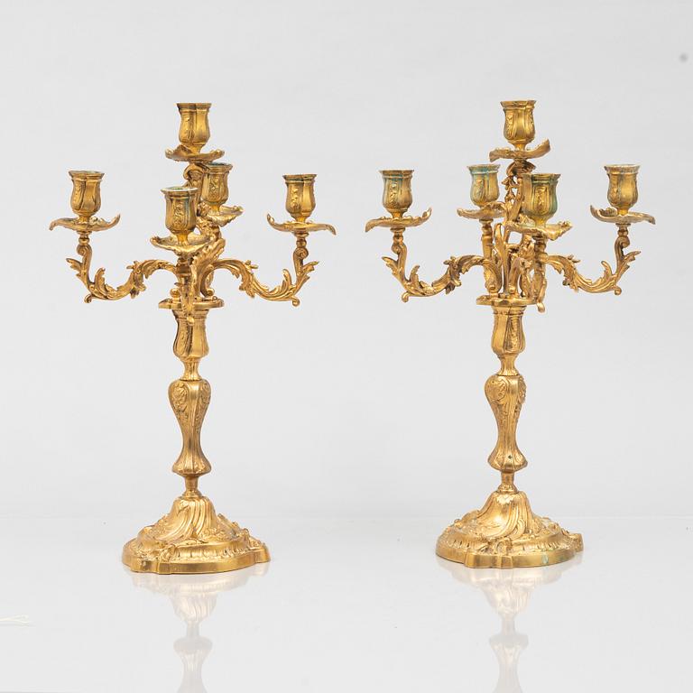 A pair of rococo style candelabras, around 1900.